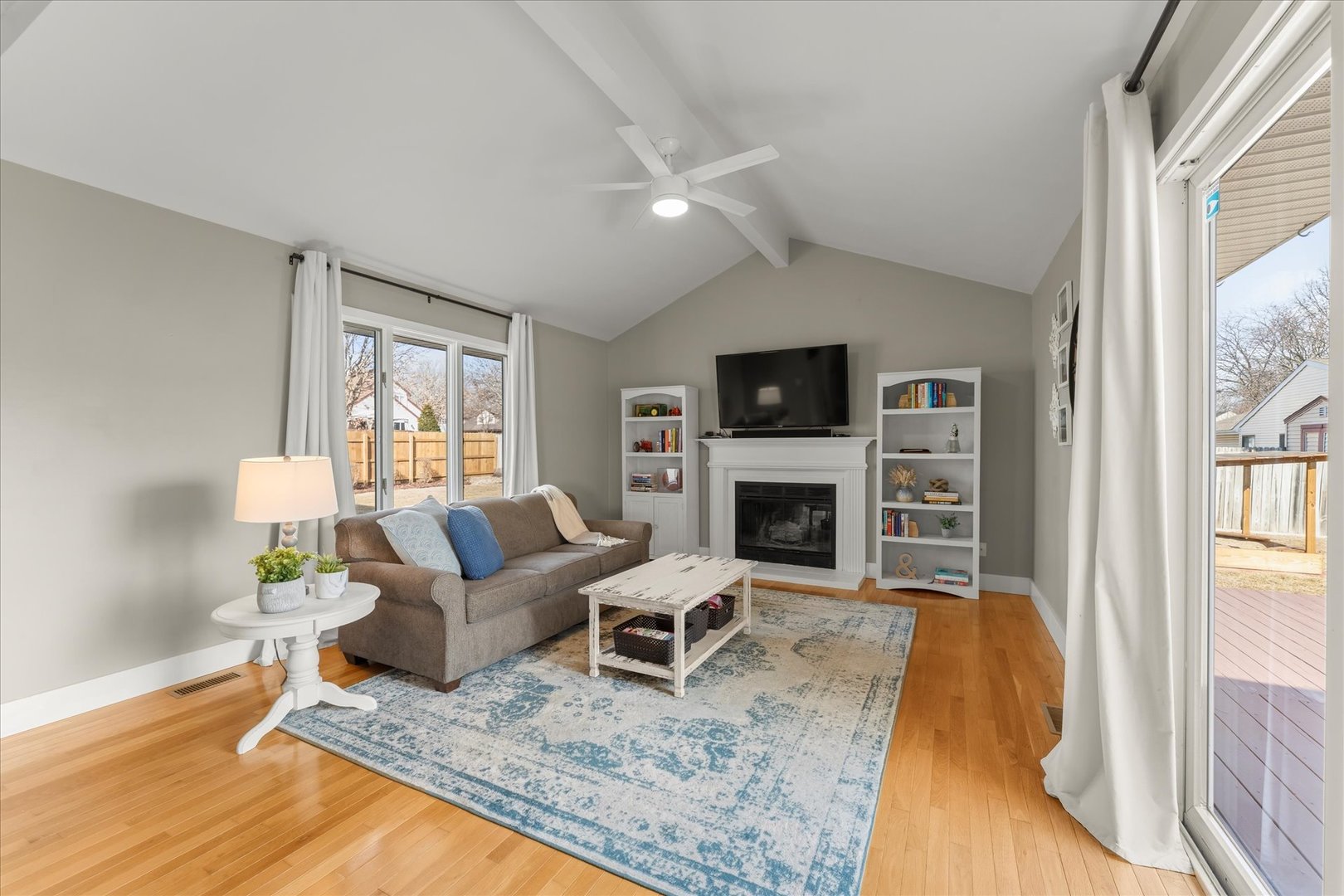 2608 Rachel Road Champaign, IL 61822 - Photo 17 of 47 a living room with furniture a fireplace and a flat screen tv