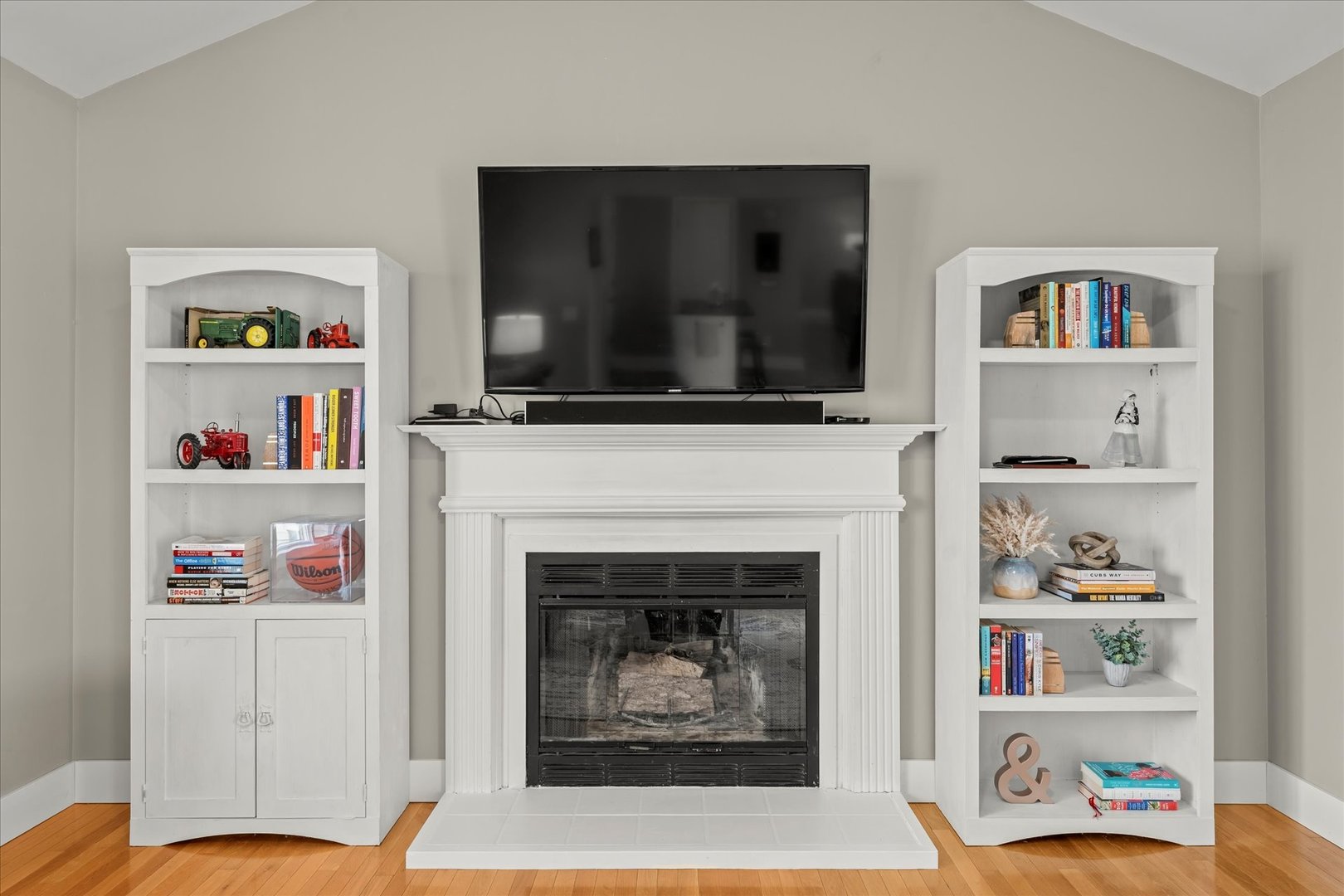 2608 Rachel Road Champaign, IL 61822 - Photo 19 of 47 a living room with a fireplace and a flat screen tv