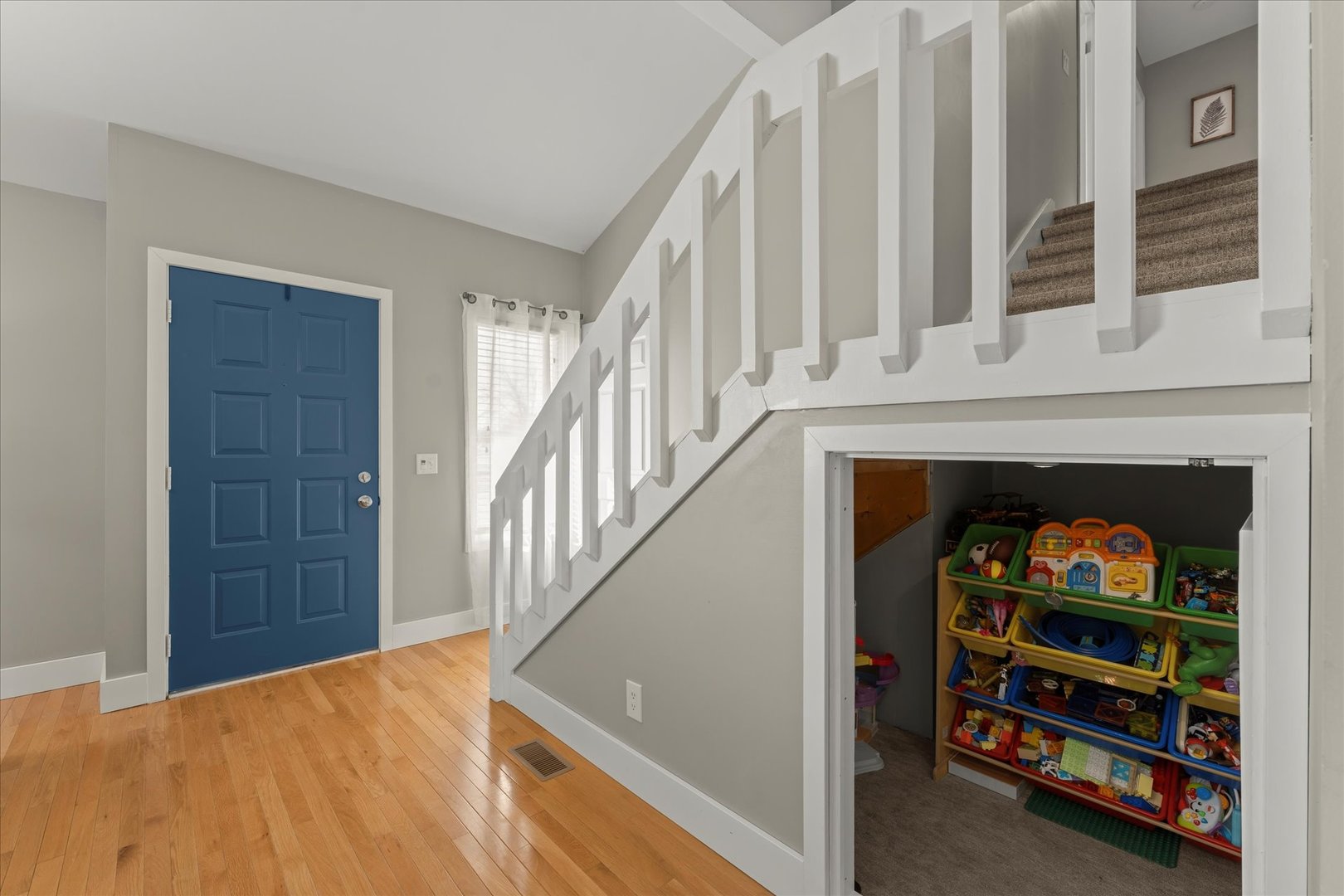 2608 Rachel Road Champaign, IL 61822 - Photo 20 of 47 a view of a hallway with wooden floor and staircase