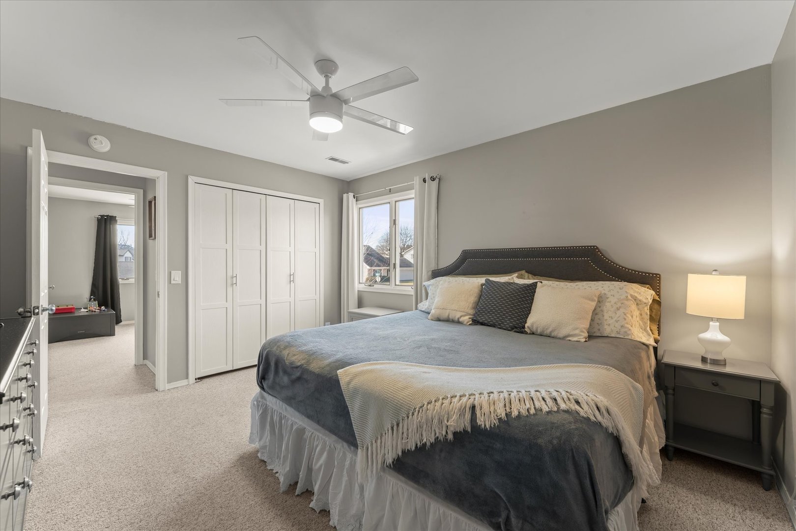 2608 Rachel Road Champaign, IL 61822 - Photo 24 of 47 a spacious bedroom with a bed and a chandelier