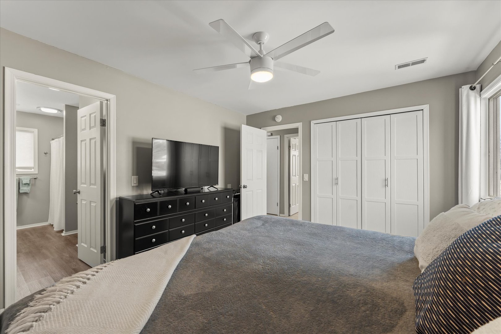 2608 Rachel Road Champaign, IL 61822 - Photo 25 of 47 a bedroom with a bed and a flat tv screen on dresser