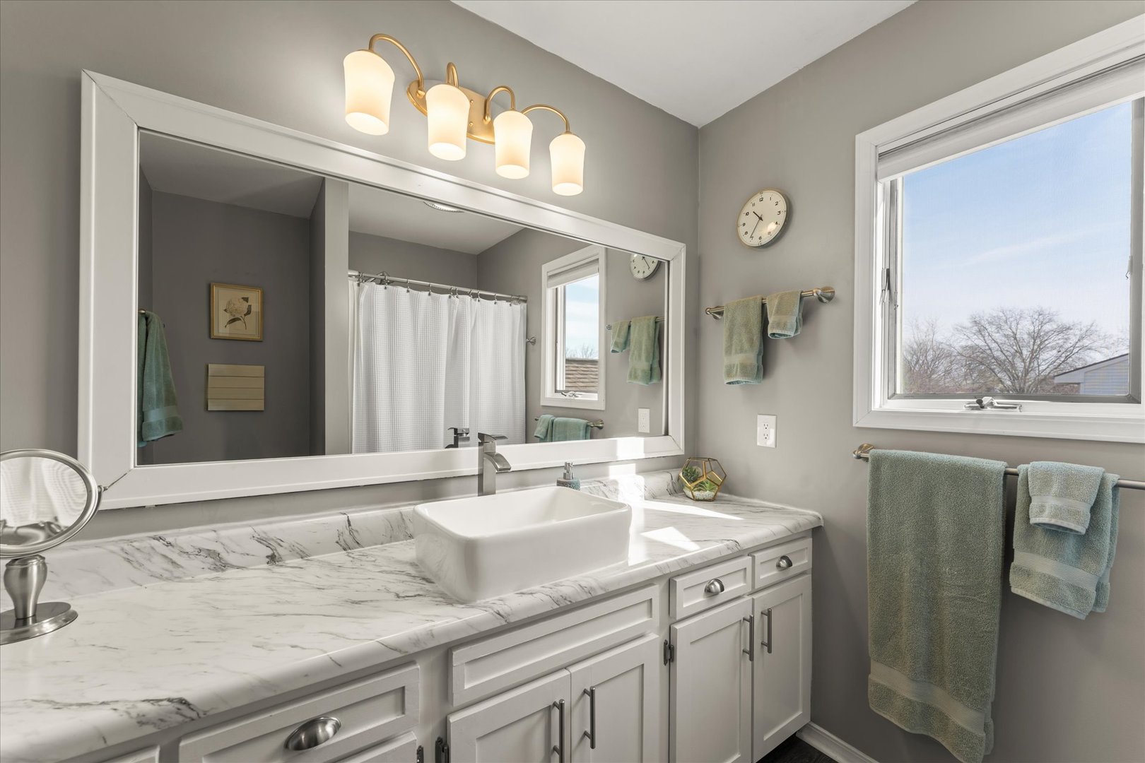 2608 Rachel Road Champaign, IL 61822 - Photo 27 of 47 a bathroom with a granite countertop sink a large mirror and a window