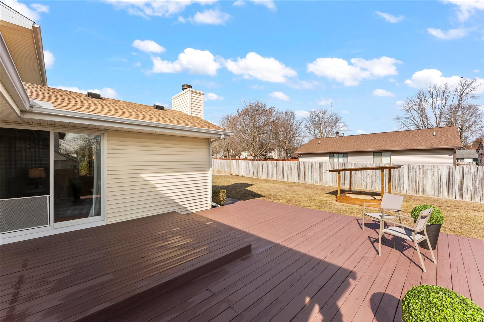 2608 Rachel Road Champaign, IL 61822 - Photo 35 of 47 a view of a patio with table and chairs with wooden floor