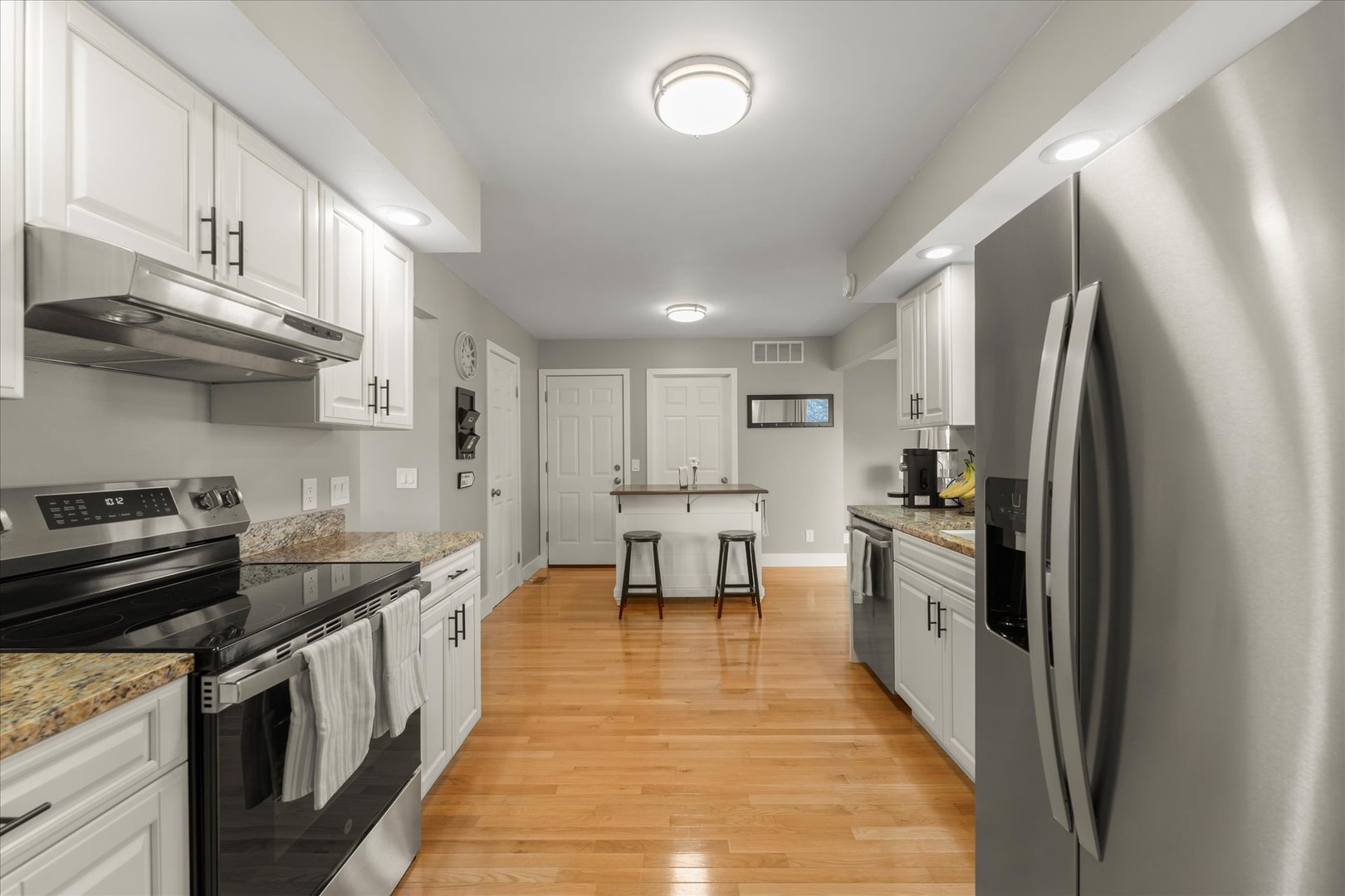 2608 Rachel Road Champaign, IL 61822 - Photo 10 of 47 a kitchen with stainless steel appliances granite countertop a stove a sink and a refrigerator