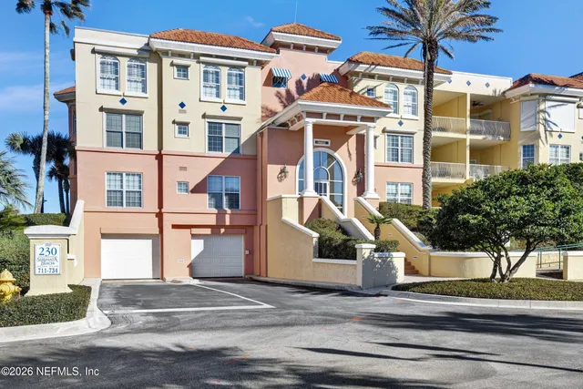 a bathroom with a sink toilet a mirror and shower curtain