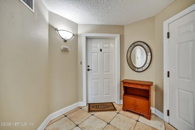 a view of a swimming pool with a table and chairs