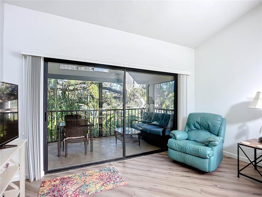 1508 Pelican Cove Road, Unit GR232 Sarasota, FL 34231 - Photo 11 of 54 a living room with furniture and a large window
