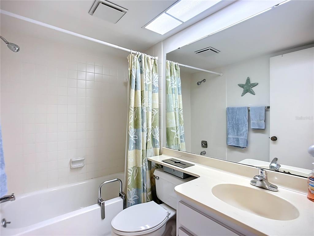 1508 Pelican Cove Road, Unit GR232 Sarasota, FL 34231 - Photo 14 of 54 a bathroom with a sink toilet tub and shower