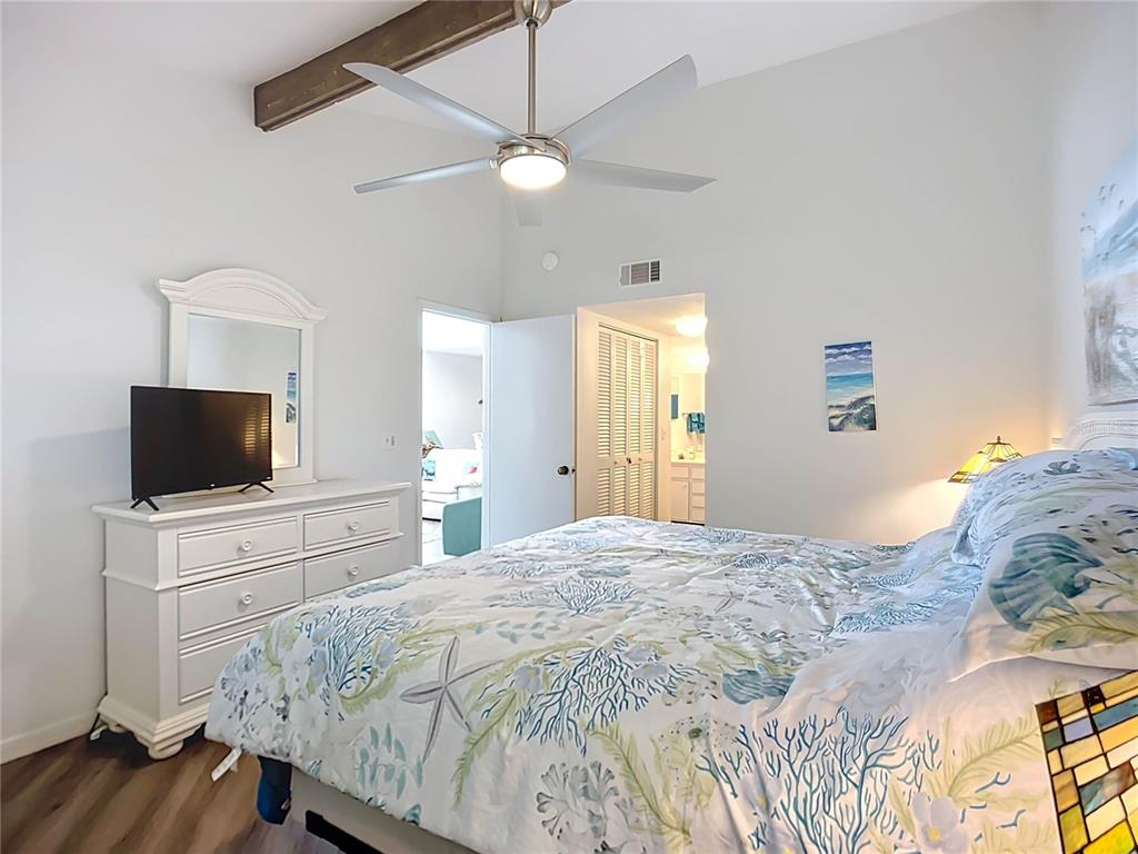 1508 Pelican Cove Road, Unit GR232 Sarasota, FL 34231 - Photo 17 of 54 a bedroom with a bed and a flat screen tv