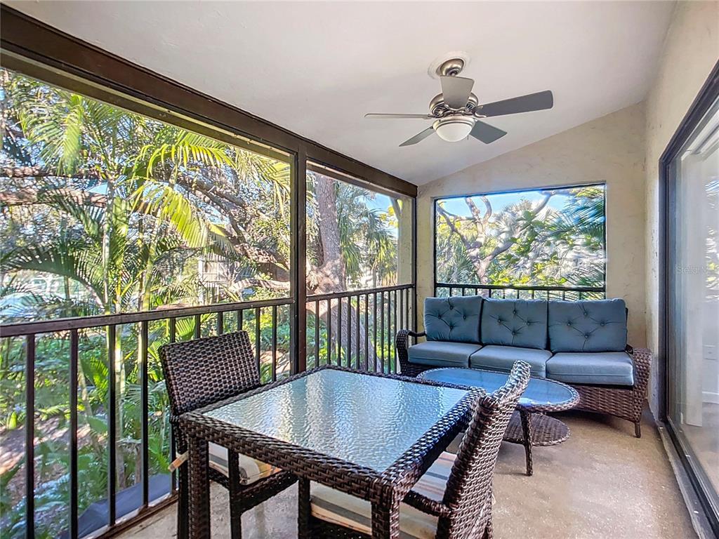 1508 Pelican Cove Road, Unit GR232 Sarasota, FL 34231 - Photo 24 of 54 a view of a dining room with furniture window and outside view
