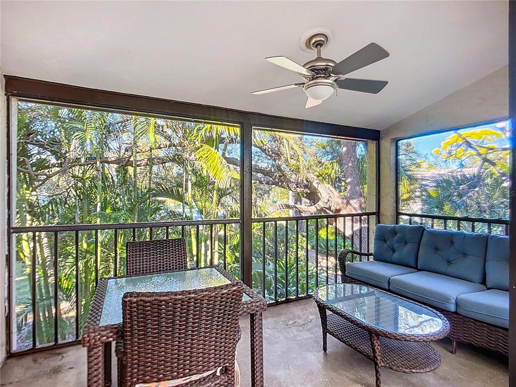 1508 Pelican Cove Road, Unit GR232 Sarasota, FL 34231 - Photo 25 of 54 a living room with large windows