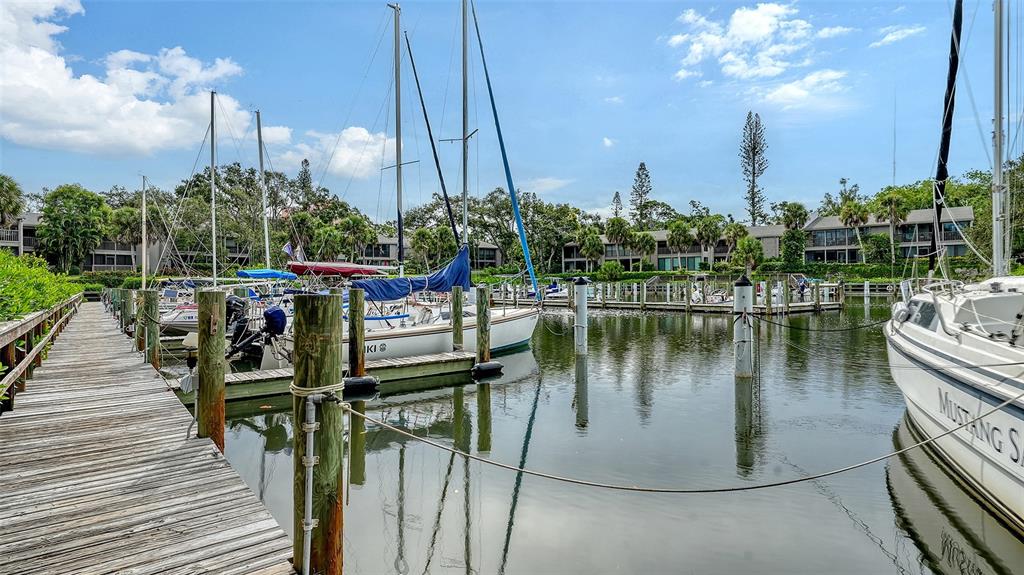 1508 Pelican Cove Road, Unit GR232 Sarasota, FL 34231 - Photo 52 of 54 a view of a lake with sitting area