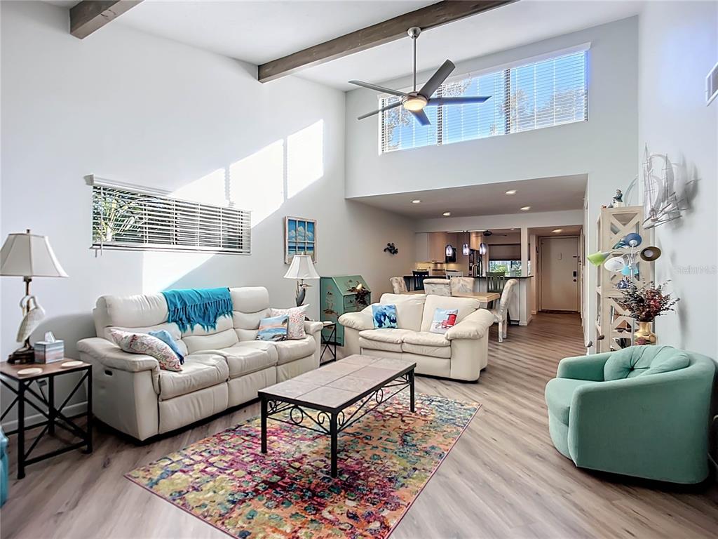 1508 Pelican Cove Road, Unit GR232 Sarasota, FL 34231 - Photo 9 of 54 a living room with furniture and a large window