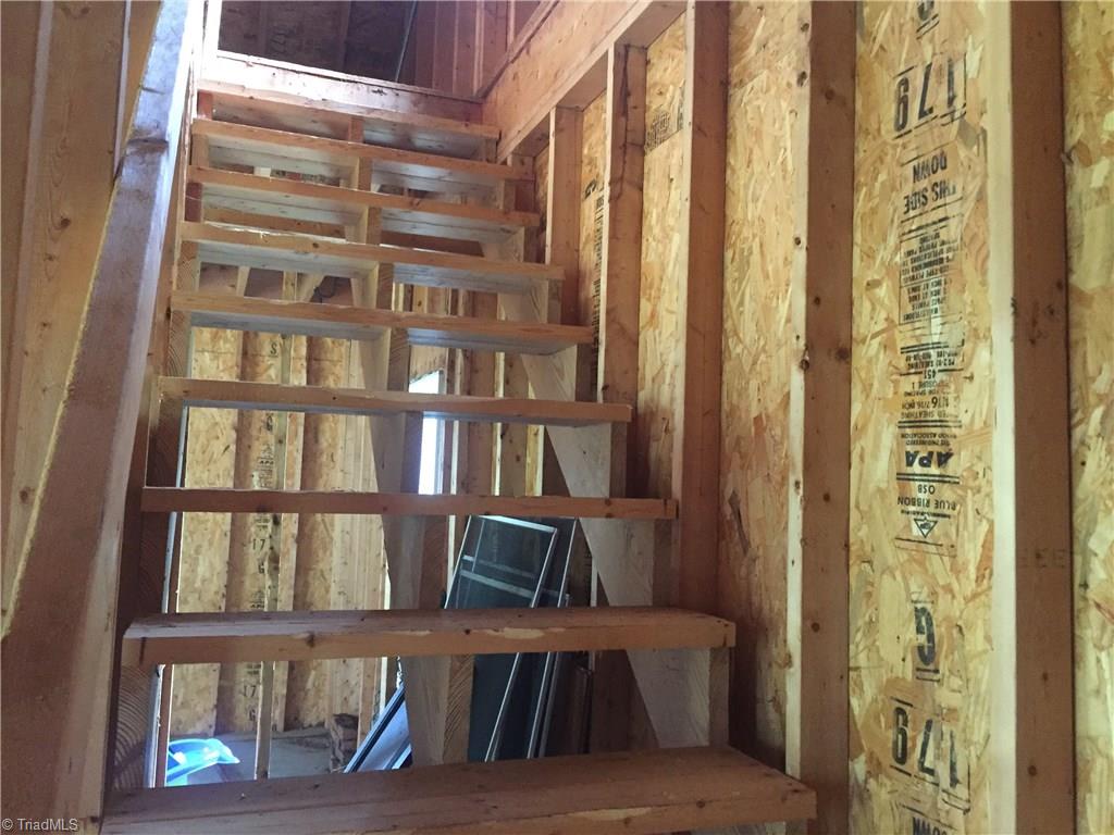 2612 Celeste Road Walkertown, NC 27051 - Photo 22 of 23 Permanent steps to attic storage in detached garage