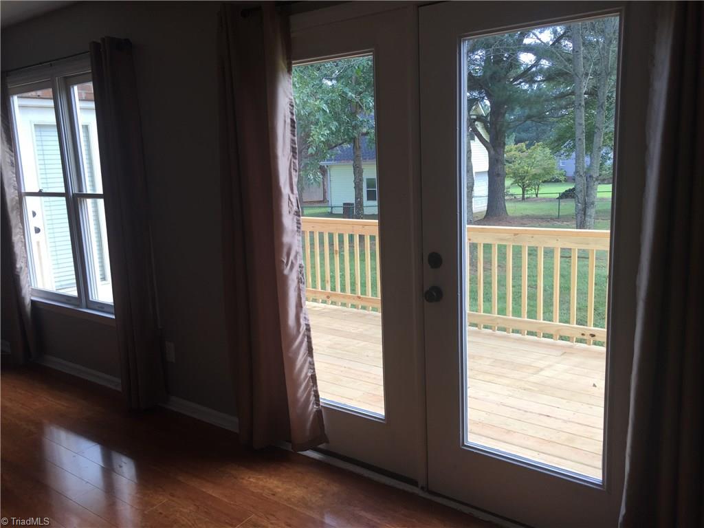 2612 Celeste Road Walkertown, NC 27051 - Photo 8 of 23 Living room and master bedroom open to a spacious deck.