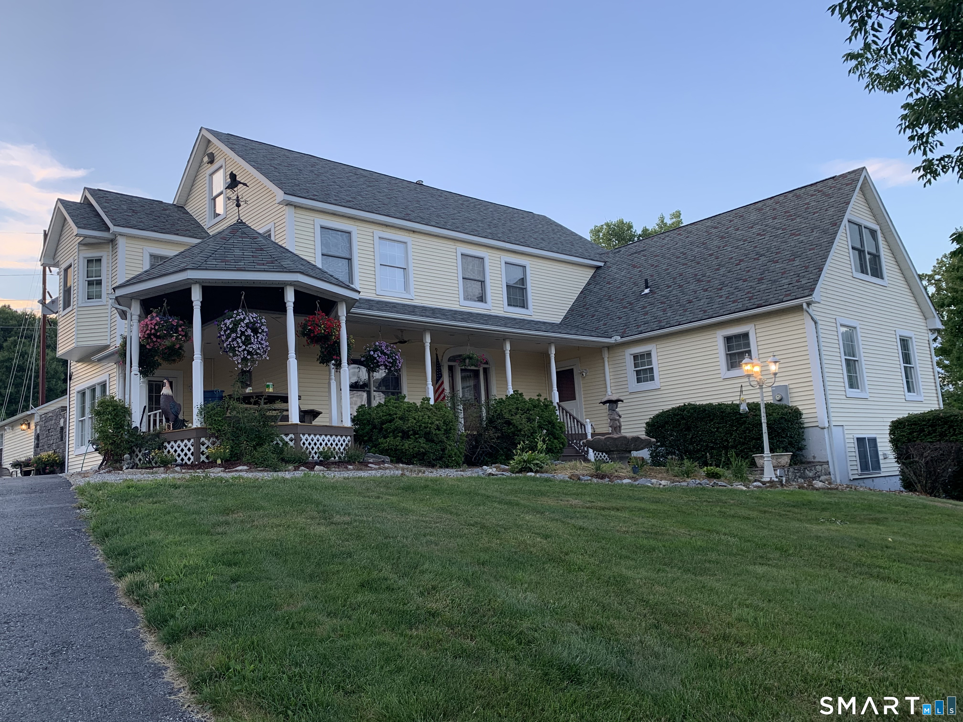 341 High Street Extension Thomaston, CT 06787 - Photo 1 of 39 a front view of a house with a yard and garage