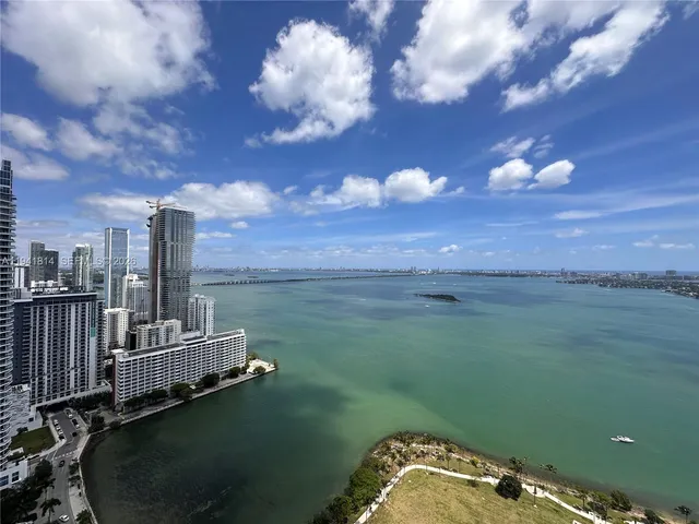 a view of a city with a lake