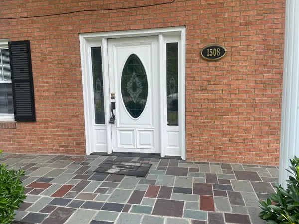 a view of a brick house with a window