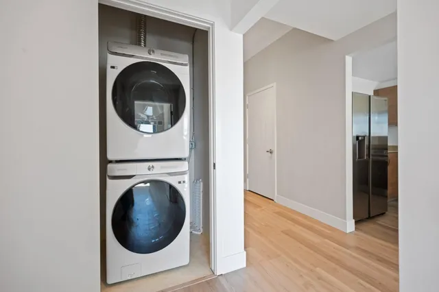 a view of a hallway with washer and dryer