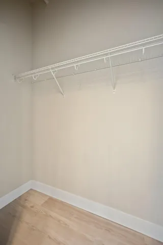 a view of a room with shelf on the wall