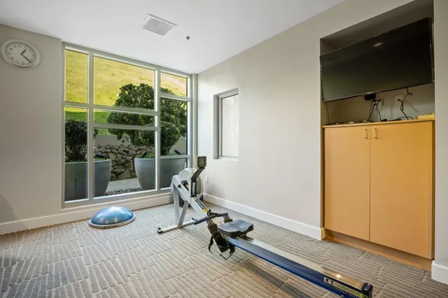 a view of room with window and wooden floor