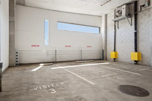 a view of a two chairs in the patio with glass door