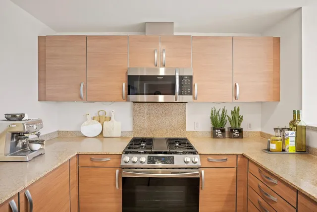 a kitchen with a stove and a sink