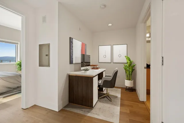 a view of kitchen with stainless steel appliances kitchen island a sink and a refrigerator