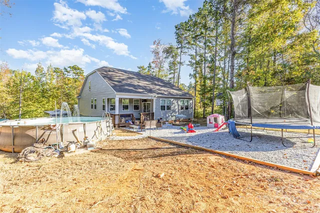 a view of a dinning table and chairs in the patio