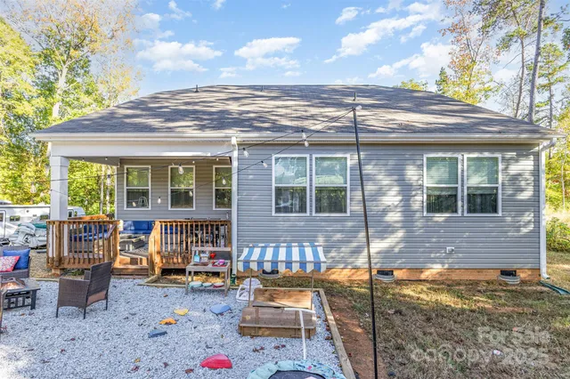 a view of a backyard with sitting area