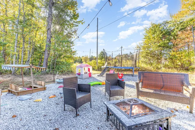 a view of yard with large trees