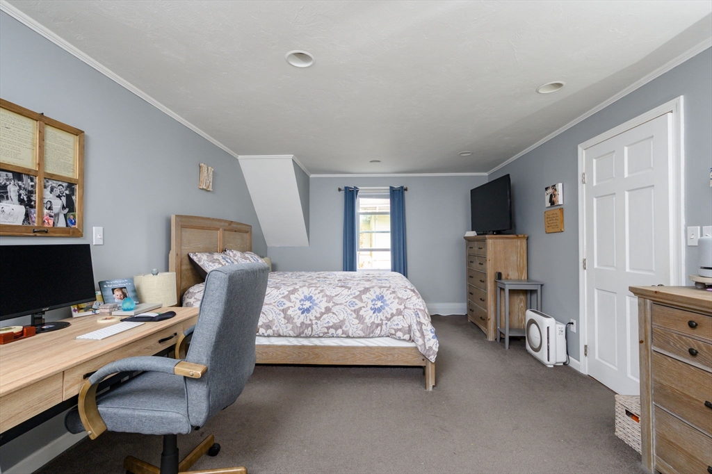 67 School Street Hanover, MA 02339 - Photo 19 of 29 a bedroom with bed and a window