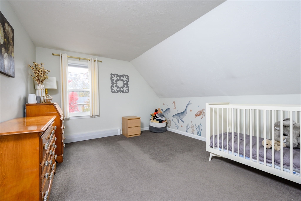 67 School Street Hanover, MA 02339 - Photo 21 of 29 a bedroom with furniture and a window