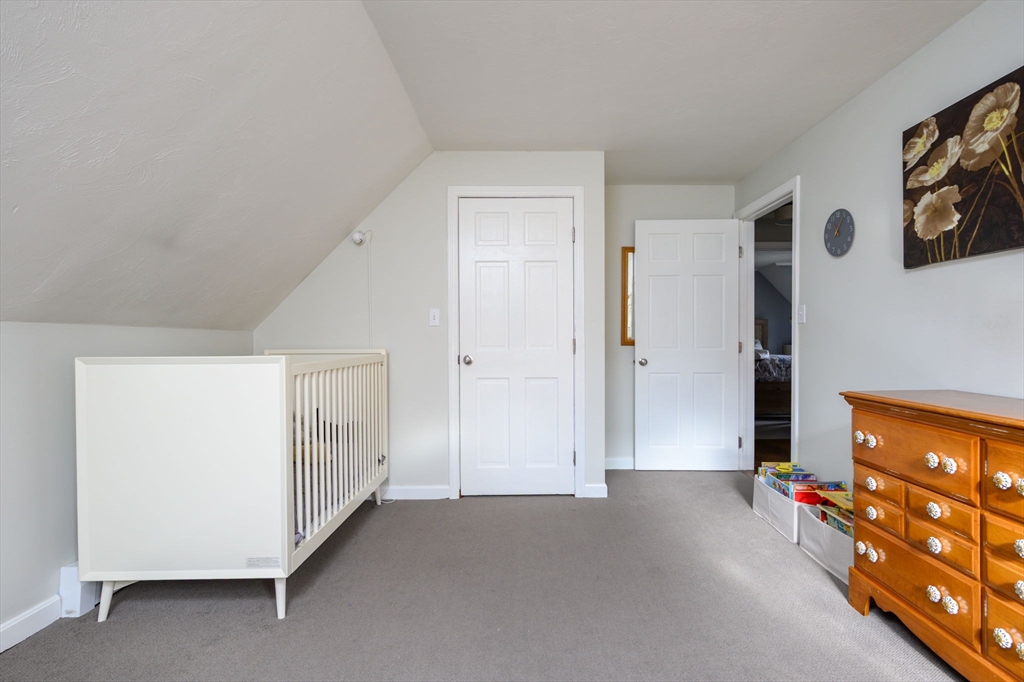 67 School Street Hanover, MA 02339 - Photo 22 of 29 a view of a livingroom with an empty space and a window