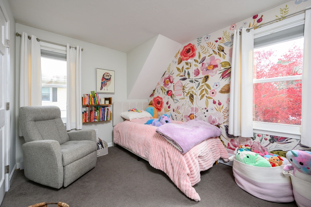 67 School Street Hanover, MA 02339 - Photo 23 of 29 a bedroom with bed and a couch