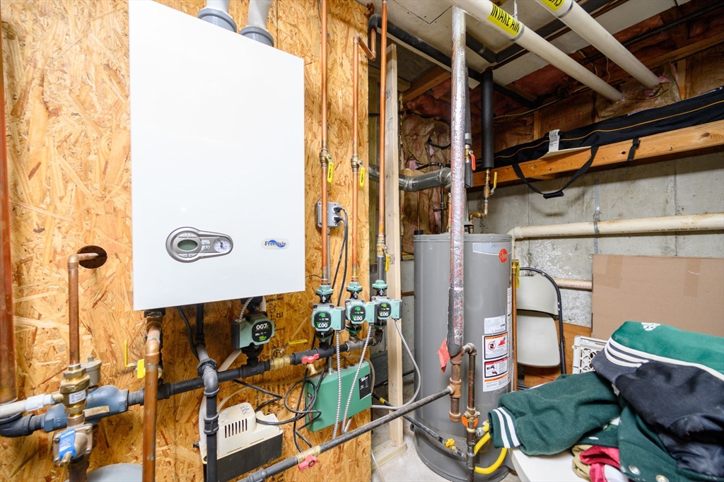 67 School Street Hanover, MA 02339 - Photo 26 of 29 a front view of a house with outdoor seating