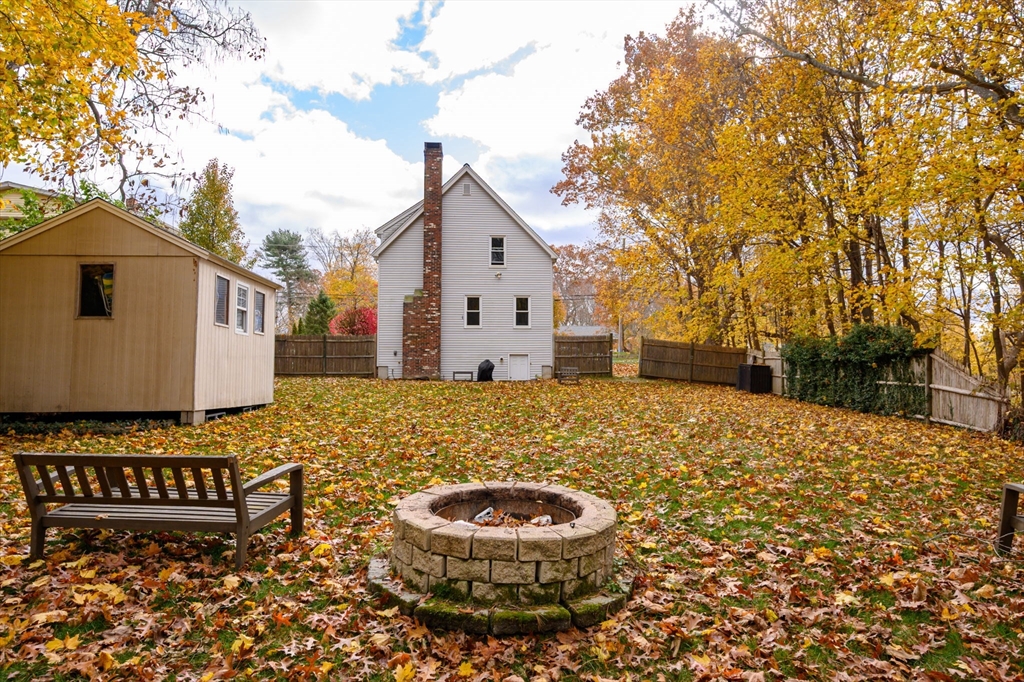 67 School Street Hanover, MA 02339 - Photo 28 of 29 a view of a white house with a yard