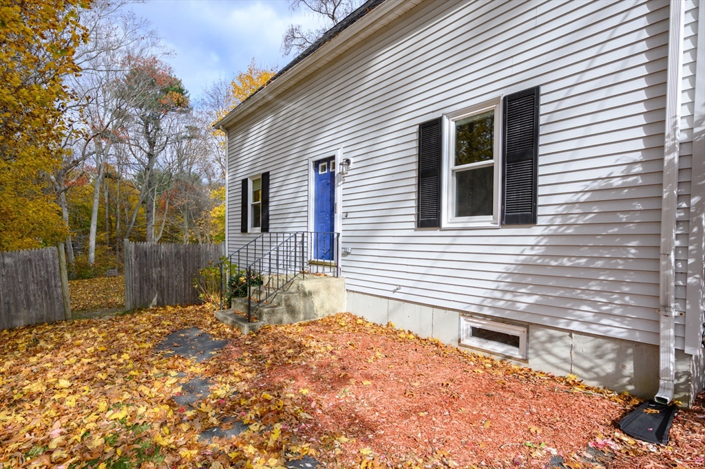 67 School Street Hanover, MA 02339 - Photo 3 of 29 a backyard of a house with table and chairs