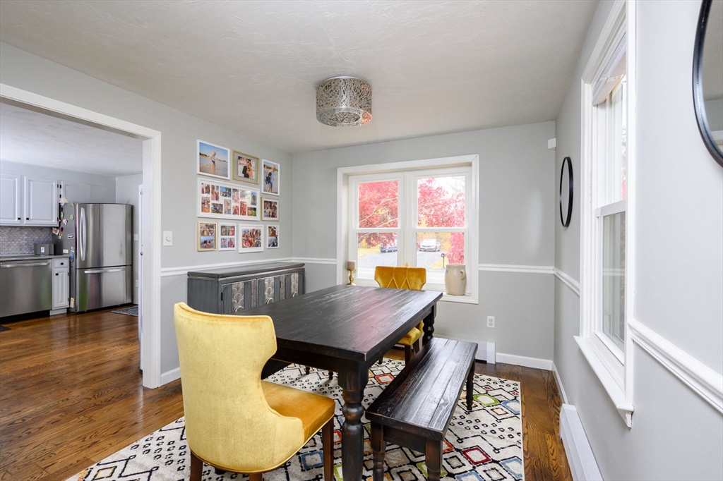 67 School Street Hanover, MA 02339 - Photo 10 of 29 a view of a dining room with furniture window and wooden floor