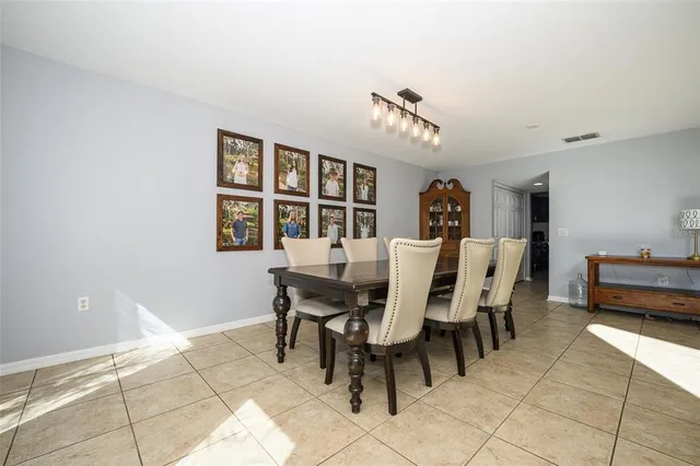 a kitchen with kitchen island granite countertop a sink counter top space appliances and cabinets