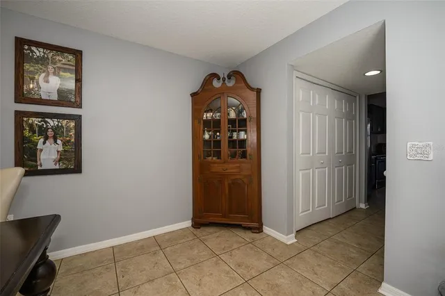 a living room with furniture a lamp and a window