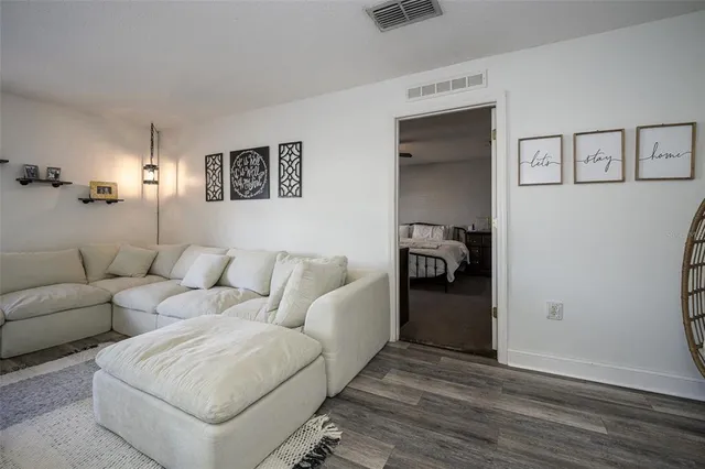 a view of livingroom with hardwood floor and closet