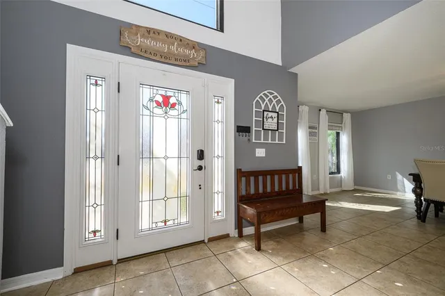 a dining room with furniture and window