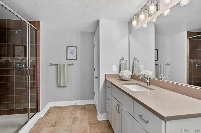 a bathroom with a sink double vanity and a mirror