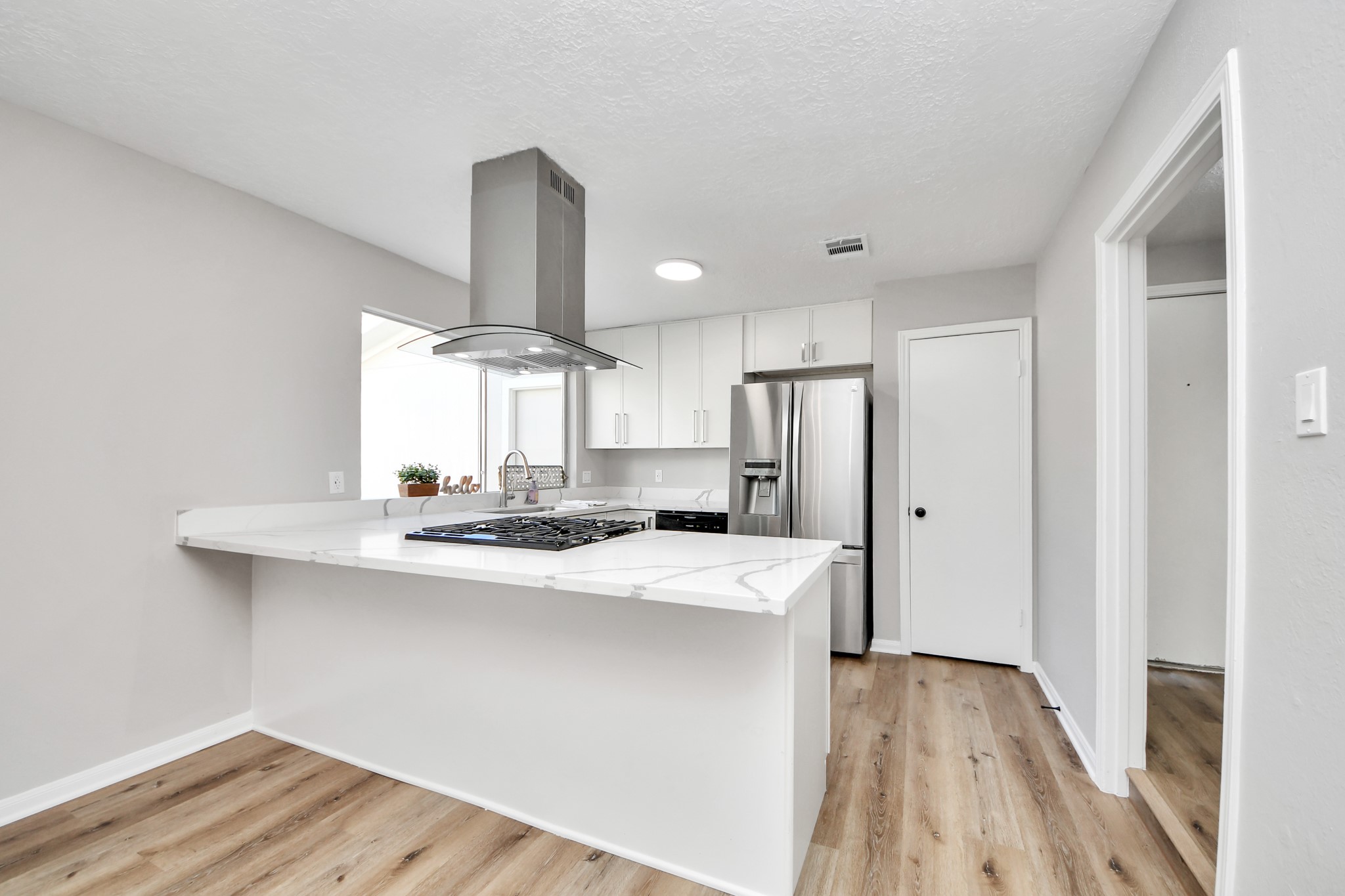 9114 Spellman Road Houston, TX 77031 - Photo 12 of 30 a kitchen with stainless steel appliances a sink and wooden floor