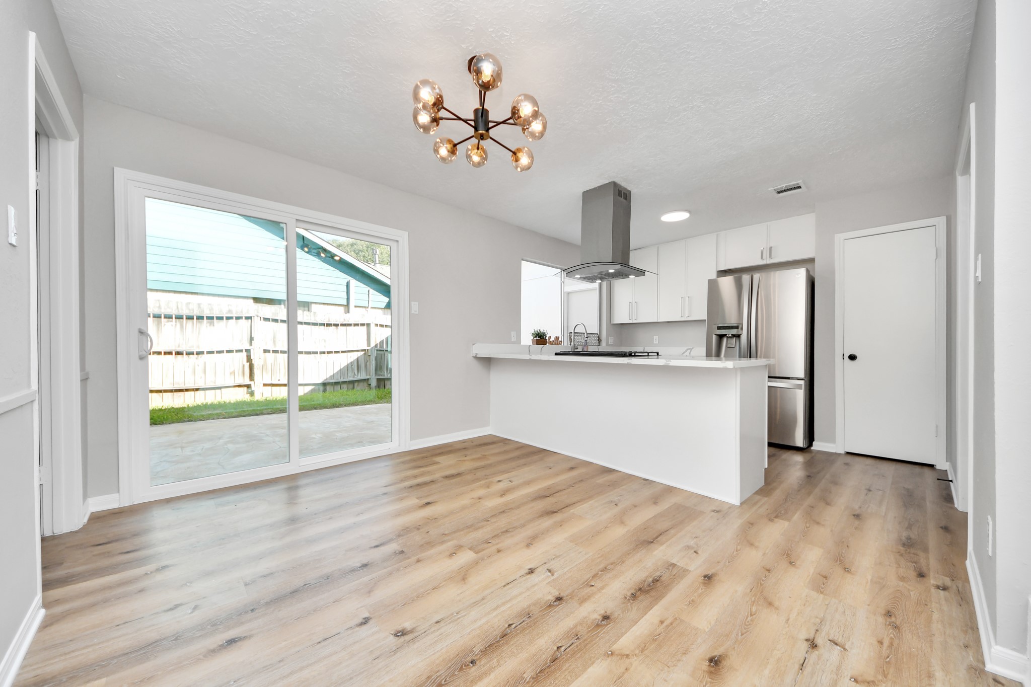 9114 Spellman Road Houston, TX 77031 - Photo 14 of 30 a view of kitchen with wooden floor and window