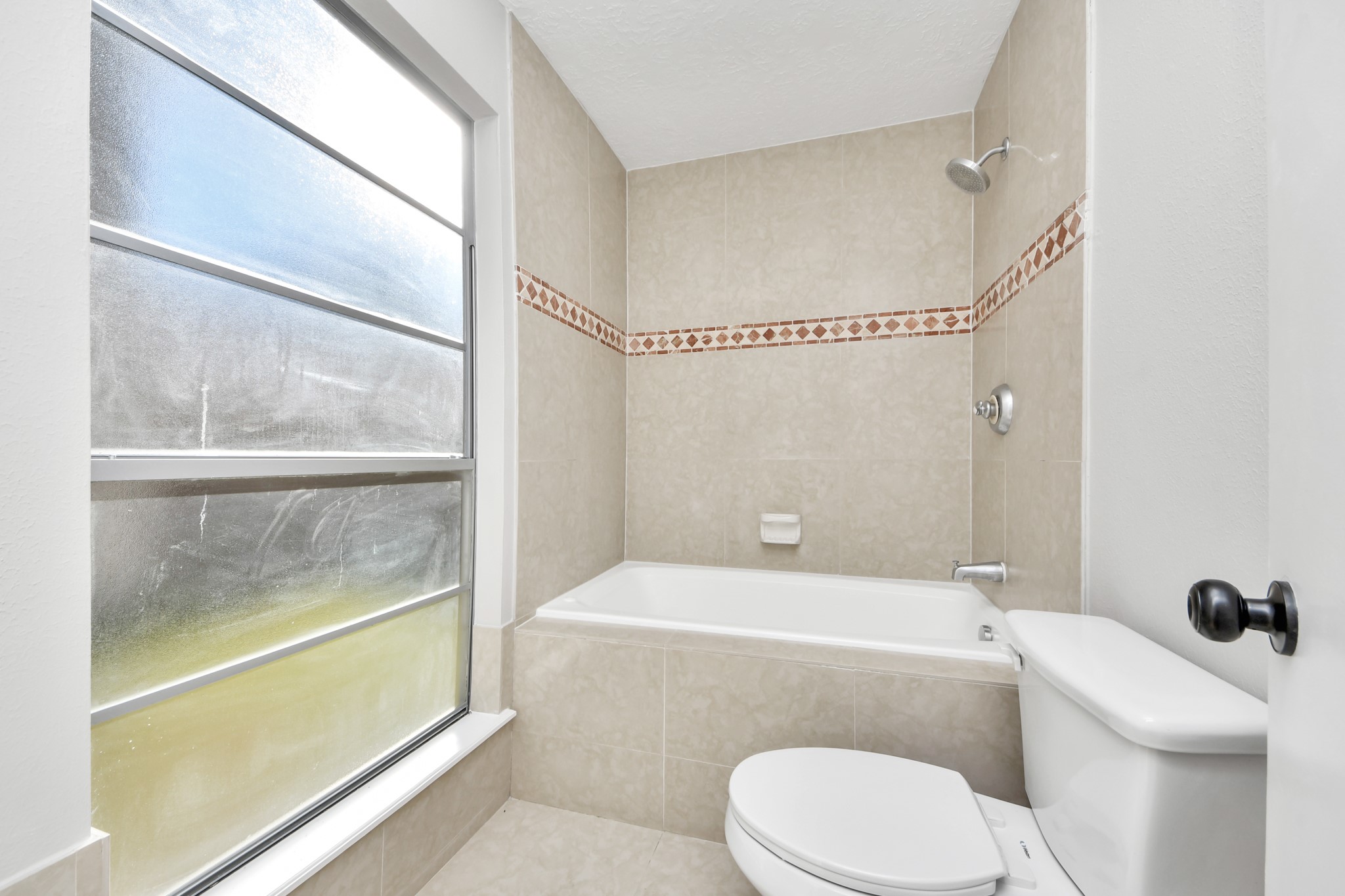 9114 Spellman Road Houston, TX 77031 - Photo 20 of 30 a bathroom with a toilet a sink and shower