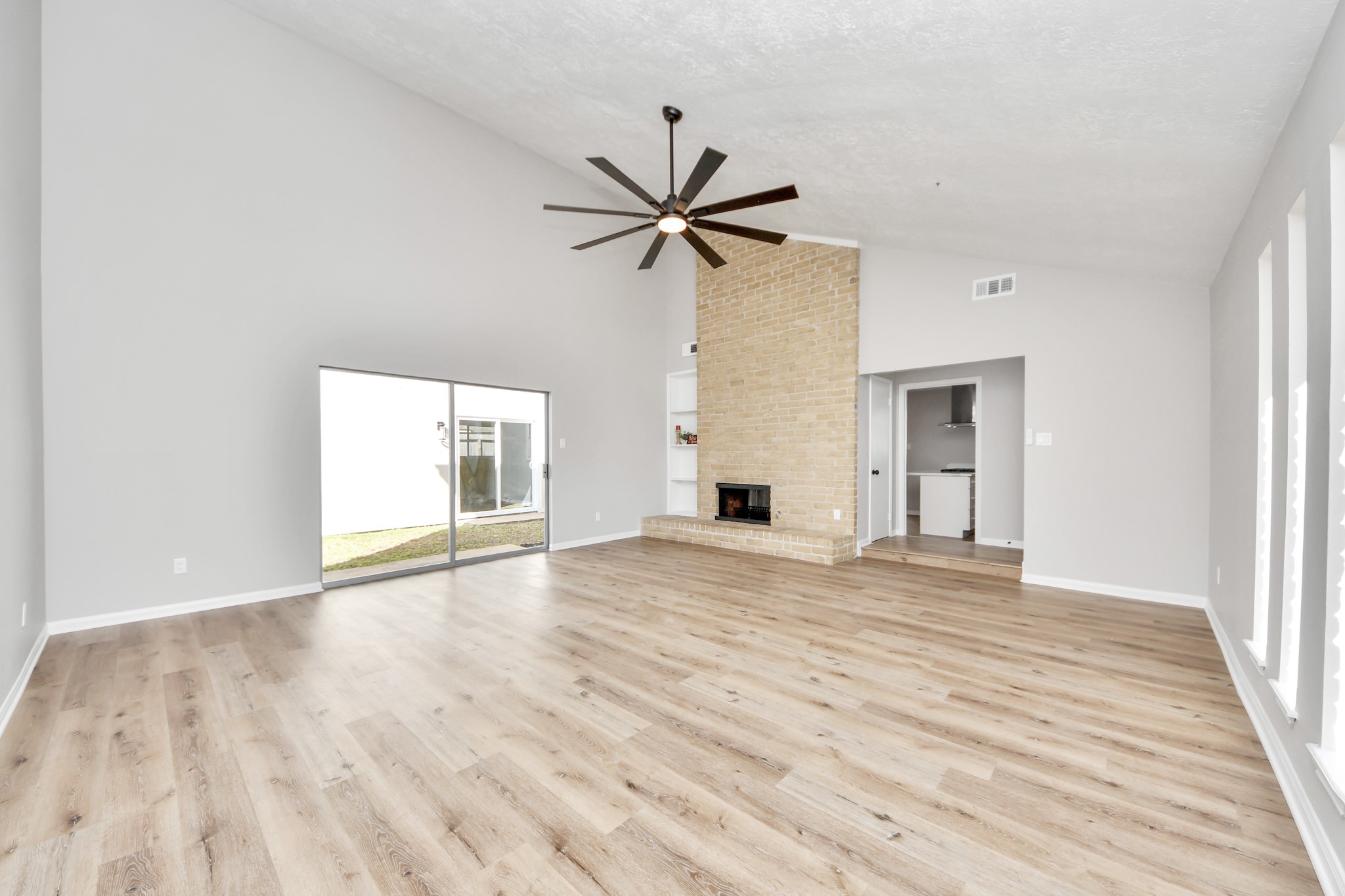 9114 Spellman Road Houston, TX 77031 - Photo 8 of 30 a view of an empty room with window and wooden floor