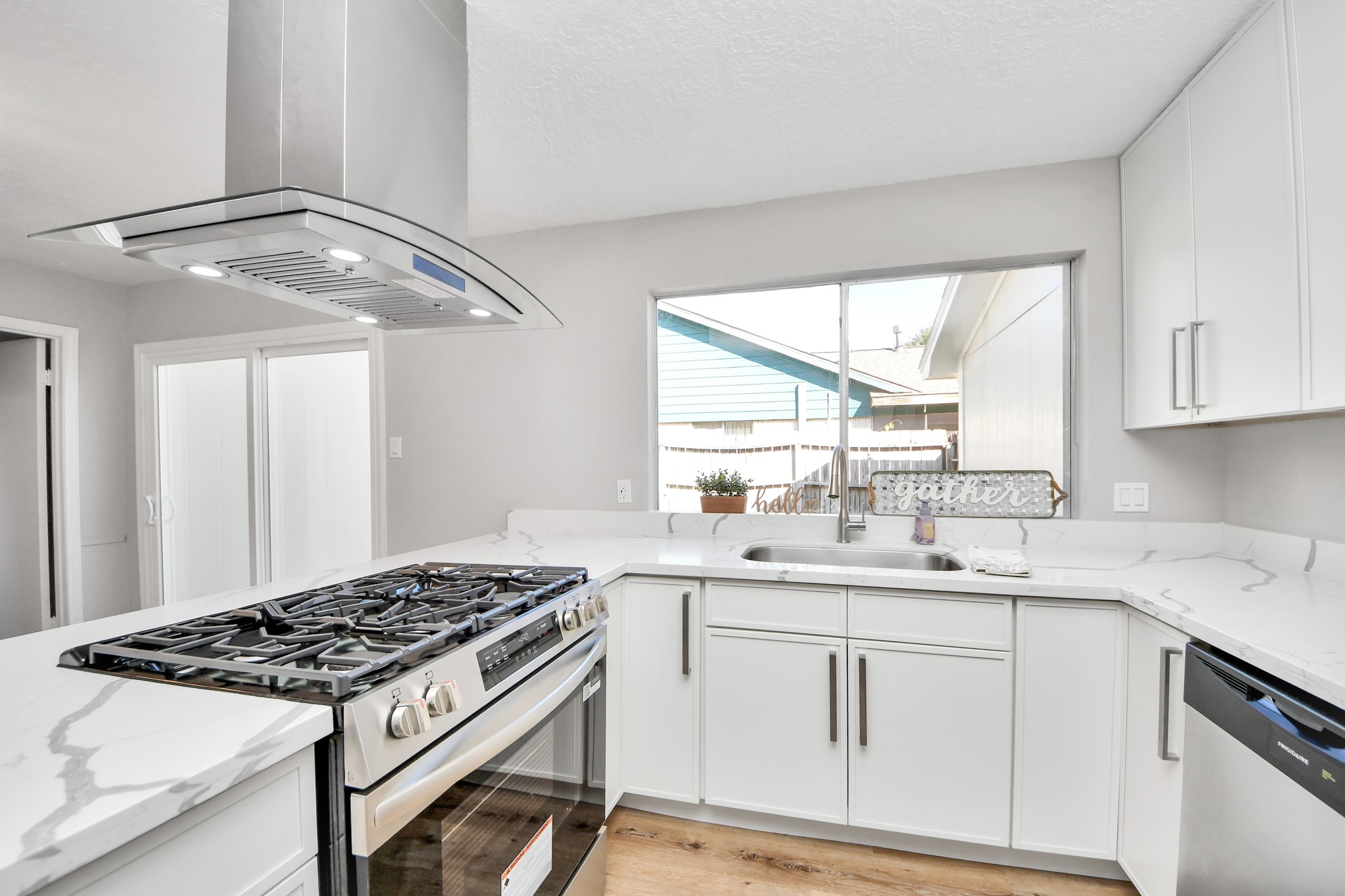 9114 Spellman Road Houston, TX 77031 - Photo 10 of 30 a kitchen with a sink stove and cabinets