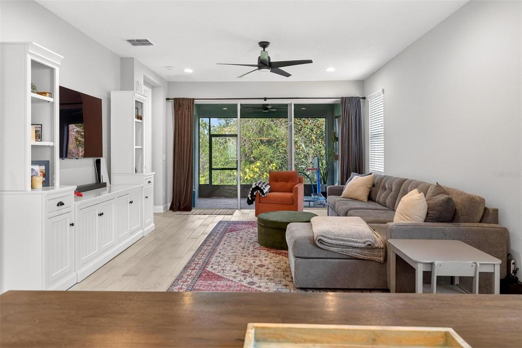 2139 Bay Line Road Oakland, FL 34787 - Photo 11 of 57 a living room with furniture and a large window